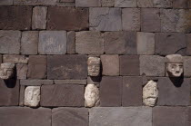 Detail of wall of the Templo Semisubterraneo sunken temple with protruding stone heads