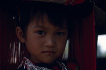 Head and shoulders portrait of Lisu girl.