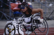 Disabled female wheelchair athlete on the start line