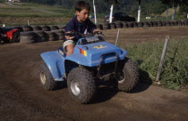 Young Basque boy near Guernica on a quad bike