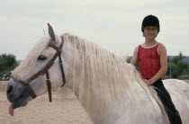 Young girl on pony