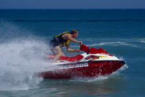 Person on a red jet ski in action