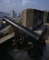 Fortaleza Do Monte. Black cannon with view to Sao Paulo Church below