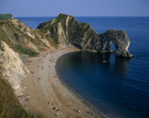 View over the beach toward eroded coastal arch.