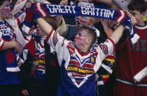 Teenage fans holding Great Britain scarfs during the Great Britain v Australia game at Wembley Stadium.