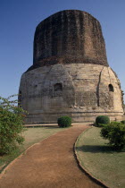 Dhamekh Stupa  elaborately carved brickwork with path leading up to it