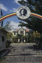 Bob Marley Museum entrance with metal gate under archway. Jamaican West Indies