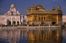 The Golden Temple reflected in rippled surface of pool.Asia Asian Bharat Inde Indian Intiya Religion Religious