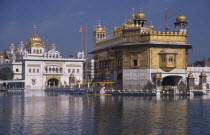 The Golden Temple reflected in surrounding pool.Asia Asian Bharat Inde Indian Intiya Religion Religious