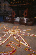 Pattern made from coloured powder and marigold petals for Diwali festivalDeepavali Asia Asian Colored Dewali Divali Festival of Lights Nepalese Religion Religious