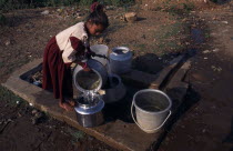 Young girl fetching water from stand pipe. Asia Asian Bharat Immature Inde Indian Intiya Kids One individual Solo Lone Solitary