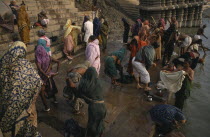 People gathered on the ghats and bathing in the River Ganges