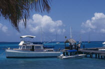 Moored yacht at the end of a wooden jettyCaribbean West Indies Windward Islands