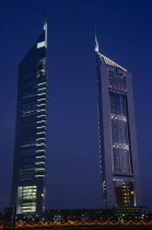 Emirates Tower illuminated at night with coloured lights in the foreground.Al-Imarat Al-Arabiyyah Al-Muttahidah Colored Dubayy Emiriti Middle East Nite United Arab Emirates Arabic Dubai