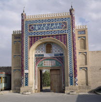 The Summer Palace. The entrance gate with vivid mosaics and wooden door