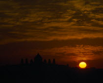 Umaid Bhawan Palace seen at sunset with orange setting sun