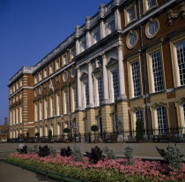 Hampton Court Palace.  Angled view of exterior over     flower borders