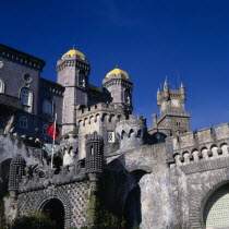 Pena Palace. Building details with golden domes and flag