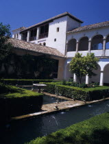 The Alhambra. Generalife Gardens. Jardin de Sultana with fountains and Generalife Palace or Summer Palace