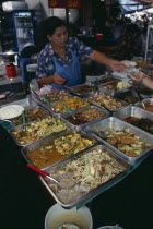 Woman selling cooked meals in an alley beside Patpong 1Asian Prathet Thai Raja Anachakra Thai Siam Southeast Asia Female Women Girl Lady Siamese Female Woman Girl Lady