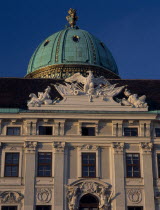 Hofburg Royal Palace. St Michael Gate facade detail and green dome seen from In der Burg Courtyard