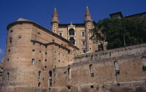 Palazzo Ducale  Renaissance palace above the town. Looking up at towers..