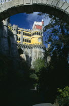 Colourful Palacio Da Pena seen through an archway