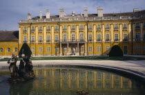 Schloss Esterhazy Palace yellow painted exterior seen from across a water fountain