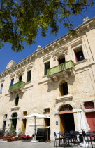 The waterfront redevelopment of old Baroque Pinto wharehouses below the bastion walls of Floriana beside the cruise ship terminal