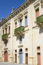 The waterfront redevelopment of old Baroque Pinto wharehouses below the bastion walls of Floriana beside the cruise ship terminal