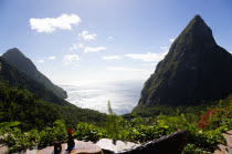 Val des Pitons View from Ladera Spa Resort Hotel overlooking the lush valley and volcanic plugs of Gros Piton on the left and Petit Piton on the right with Jalousie beach between the mountainsCaribbe...