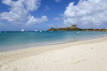 Pigeon Island National Historic Park seen from a nearby beach on a causeway to the island with yachts at anchor in Rodney BayCaribbean West Indies Windward Islands Beaches Resort Sand Sandy Scenic Se...