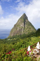 Val des Pitons The volcanic plug of Petit Piton and the lush valley seen from the sun deck of the Ladera Spa Resort HotelCaribbean West Indies Windward Islands Holidaymakers Scenic Tourism Tourist Si...