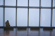 Woman sitting alone at one of the benches in the Tokyo Art Museum and exhibition hall.geometrylineslonelymoodfeelingemotionbuildingstructureFar East1 Asia Asian Female Women Girl Lady Japane...