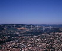 Millau.  Cityscape with Millau bridge beyond which carries the A75 motorway from Beziers to Clermont Ferrand.