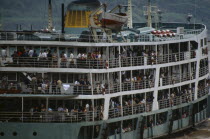 Ferry on the River Yangtsi with people crowded on the deckAsia Asian Chinese Chungkuo Jhonggu Zhonggu