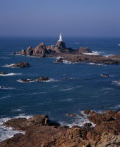 St Brelade. Corbiere Lighthouse and rocky foreshoreEuropean Scenic Northern Europe