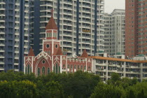 The Catholic Cathedral among modern apartment blocksAsia Asian Chinese Chungkuo Jhonggu Zhonggu Christian Flat Religious