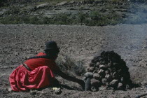 Liquivi Lamla woman boiling / cooking potatoesAmerican Farming Agraian Agricultural Growing Husbandry  Land Producing Raising Agriculture Bolivian Female Women Girl Lady Hispanic Latin America Latino...