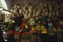 Market stall selling fruit   vegetables and locally made basketsAmerican Bolivian Chuquisaca Hispanic Latin America Latino South America