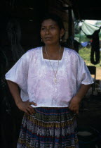 Portrait of a Q eqchi Indian mother wearing a white blouse and a gold crucifix necklace in a Sacaak refugee settlementIndigenous people American Central America Hispanic Indegent Latin America Latino...