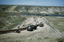 Constructing Trans Canada gas pipeline over Saskatchewan Prairies. American Canadian North America