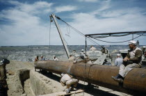 Constructing Trans Canada gas pipeline over Saskatchewan Prairies. 34inch front end join.American Canadian North America