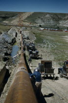 Constructing Trans Canada gas pipeline over Saskatchewan Prairies. American Canadian North America