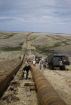 Constructing Trans Canada gas pipeline over Saskatchewan Prairies. American Canadian North America