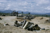 Vietnam War. Siege of Kontum. Montagnard soldiers in base with empty shells from heavy artillery in the foregroundKon TumAsian Southeast Asia Viet Nam Vietnamese