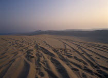 View over sand dunes at sunset near the Sealine Resort.An area for four wheel drive wadi bashing. 4 Middle East Qatari Scenic Southern