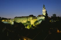 Czech Republic, South Bohemia, Cesky Krumlov, View of the Chateaux and Round Tower illuminated at night.