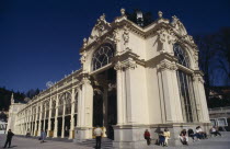 Exterior of spa with arched windows colonnade and multiple carved figures and decorative motifsZapadoceskyMarianske Lazne Ceska Eastern Europe European Holidaymakers Tourism Tourist