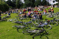 Tour de France Kent stage 2007  bike left in park as people view the passing riders on a large screen.European French Western Europe